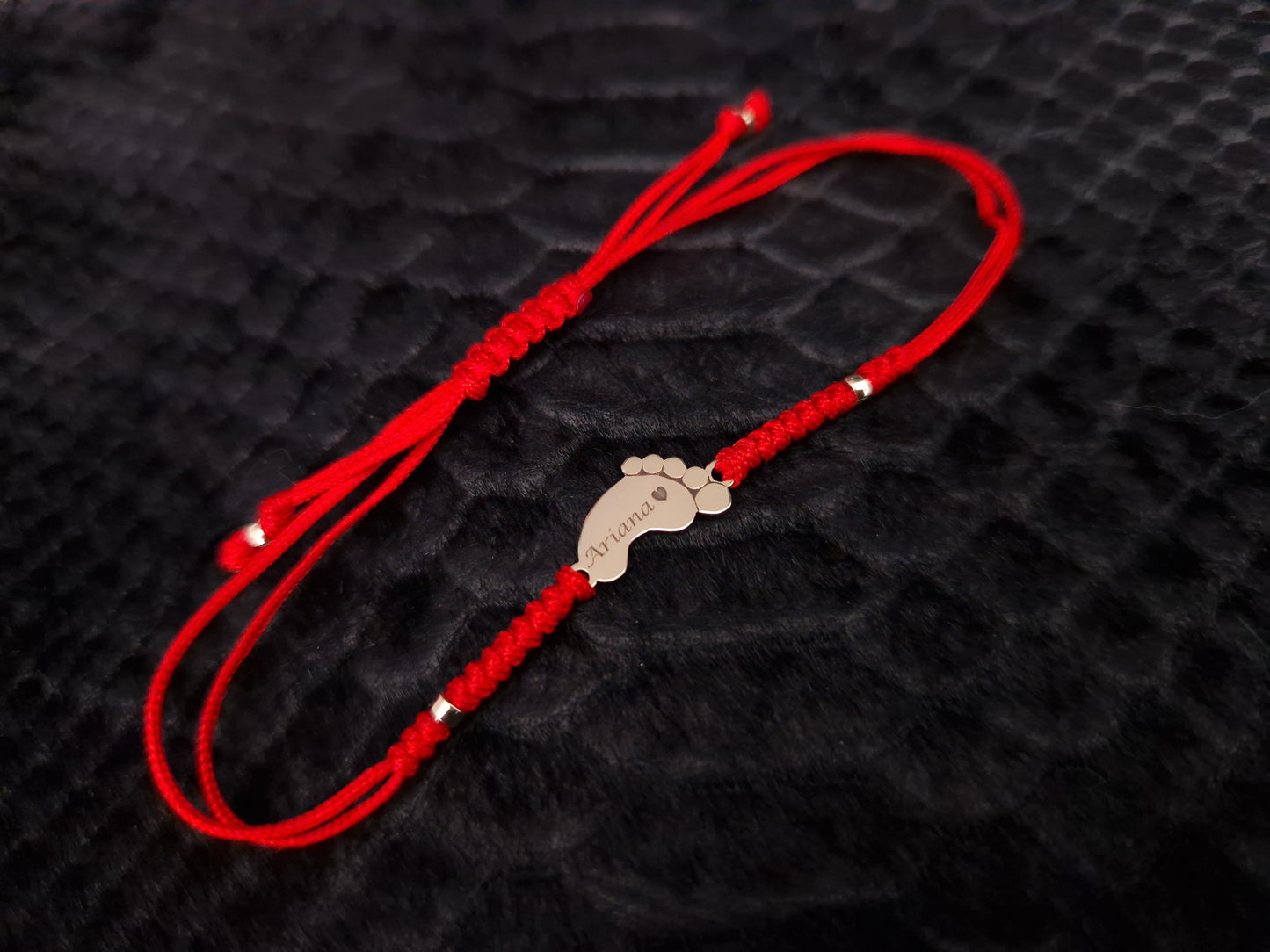 Red thread bracelet with gold bead