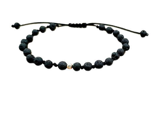 Bracelets made of gold beads and natural lava stones