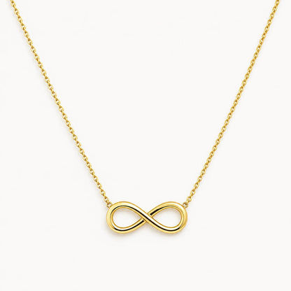 Lucche 14K gold infinity symbol pendant on a delicate gold chain against a white background